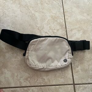 NWOT Lululemon cream and black nylon belt bag
